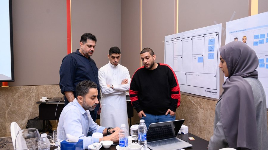 Founders working through a business model canvas in a workshop